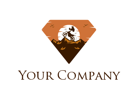 sun behind biker stunting on bike on mountains in diamond